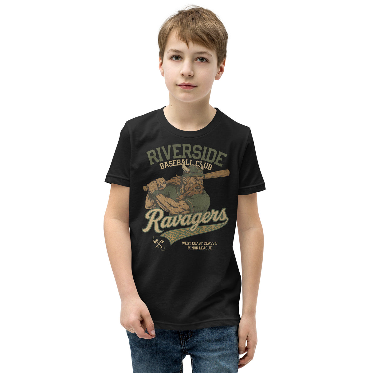Young boy smiling while wearing a Riverside Ravagers youth t-shirt in black, featuring the retro Viking mascot from Outfield Outlaws’ baseball apparel line.