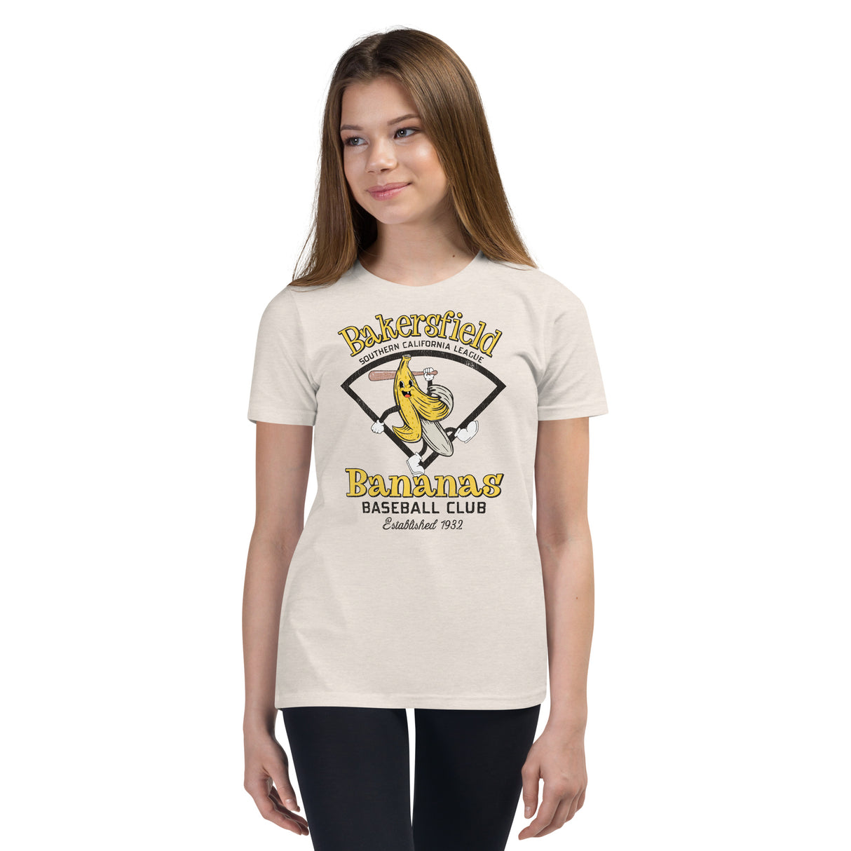 Girl wearing Bakersfield Bananas youth shirt – goofy mascot design