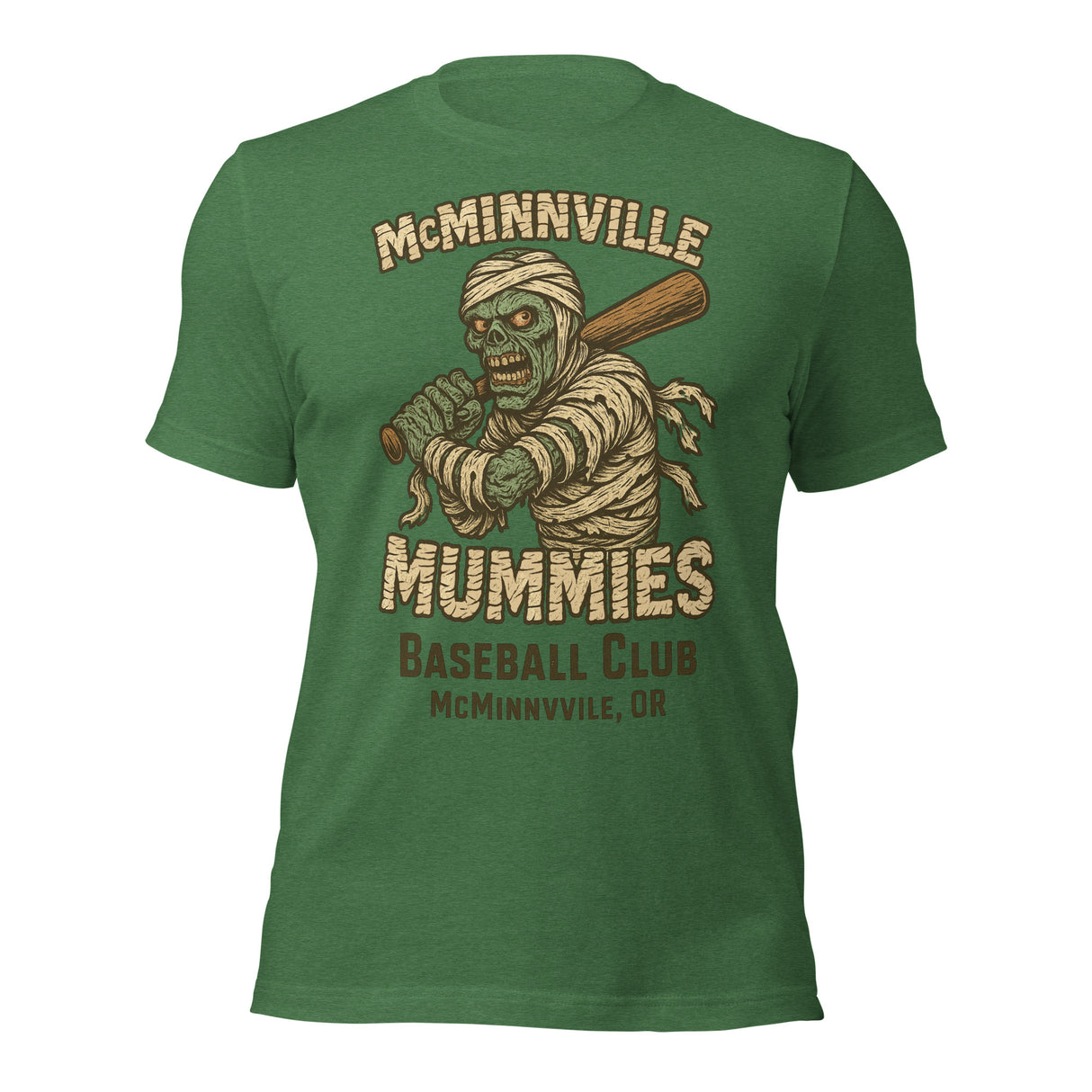 Flat lay of McMinnville Mummies retro baseball t-shirt in heather grass green, showcasing vintage mummy mascot and distressed design.