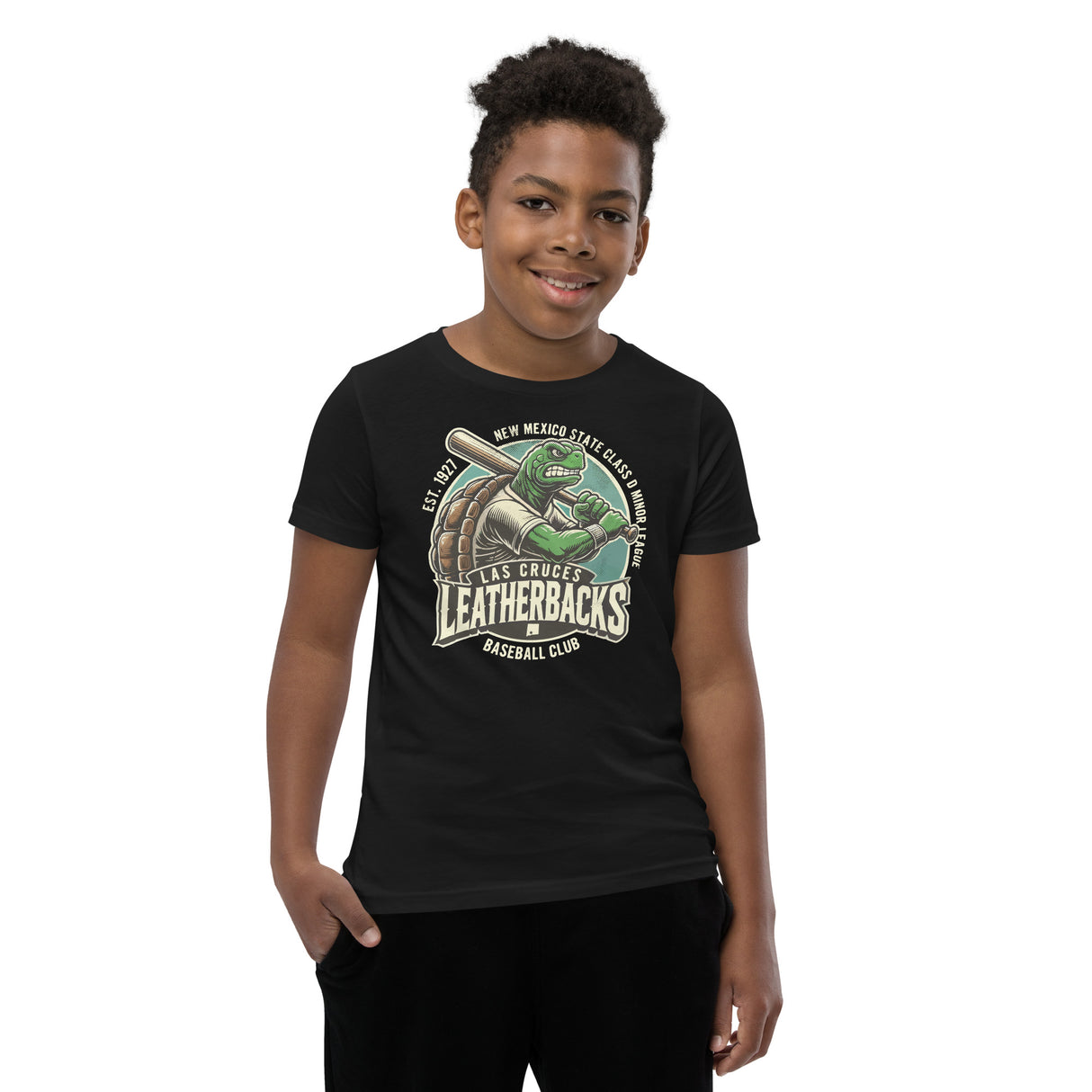 Young boy wearing black Las Cruces Leatherbacks youth t-shirt, showcasing retro minor league turtle mascot on front