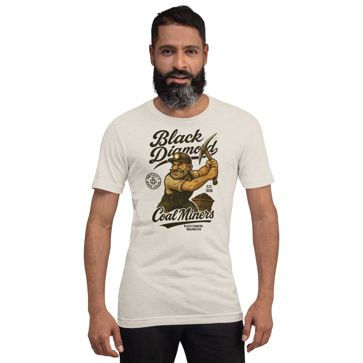 Male model wearing Black Diamond Coal Miners tee in Heather Dust, showing retro baseball graphic on front.