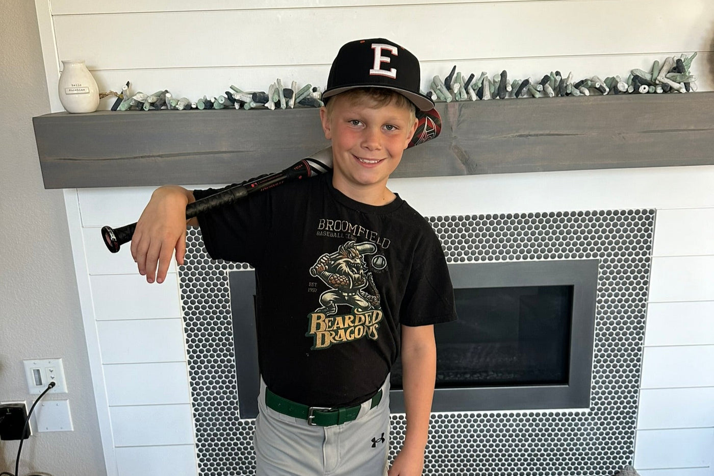 boy repping Outfield Outlaws shirt