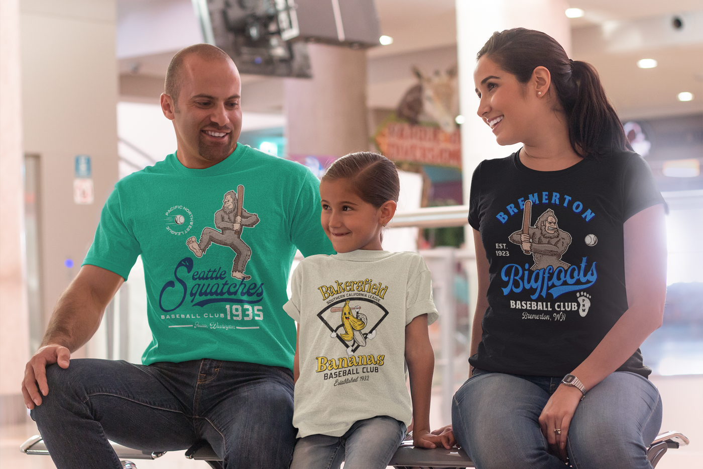 mom, dad, and daughter wearing funny retro mascot baseball shirts