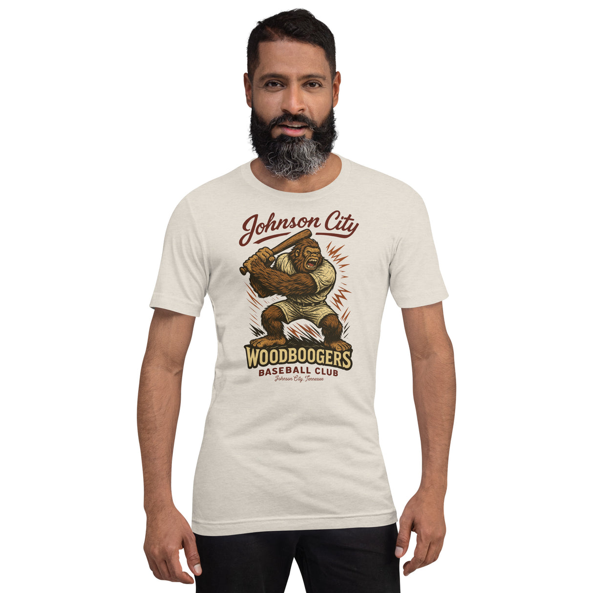 Male model wearing Johnson City Woodboogers Bigfoot t-shirt from Outfield Outlaws, retro-style baseball tee