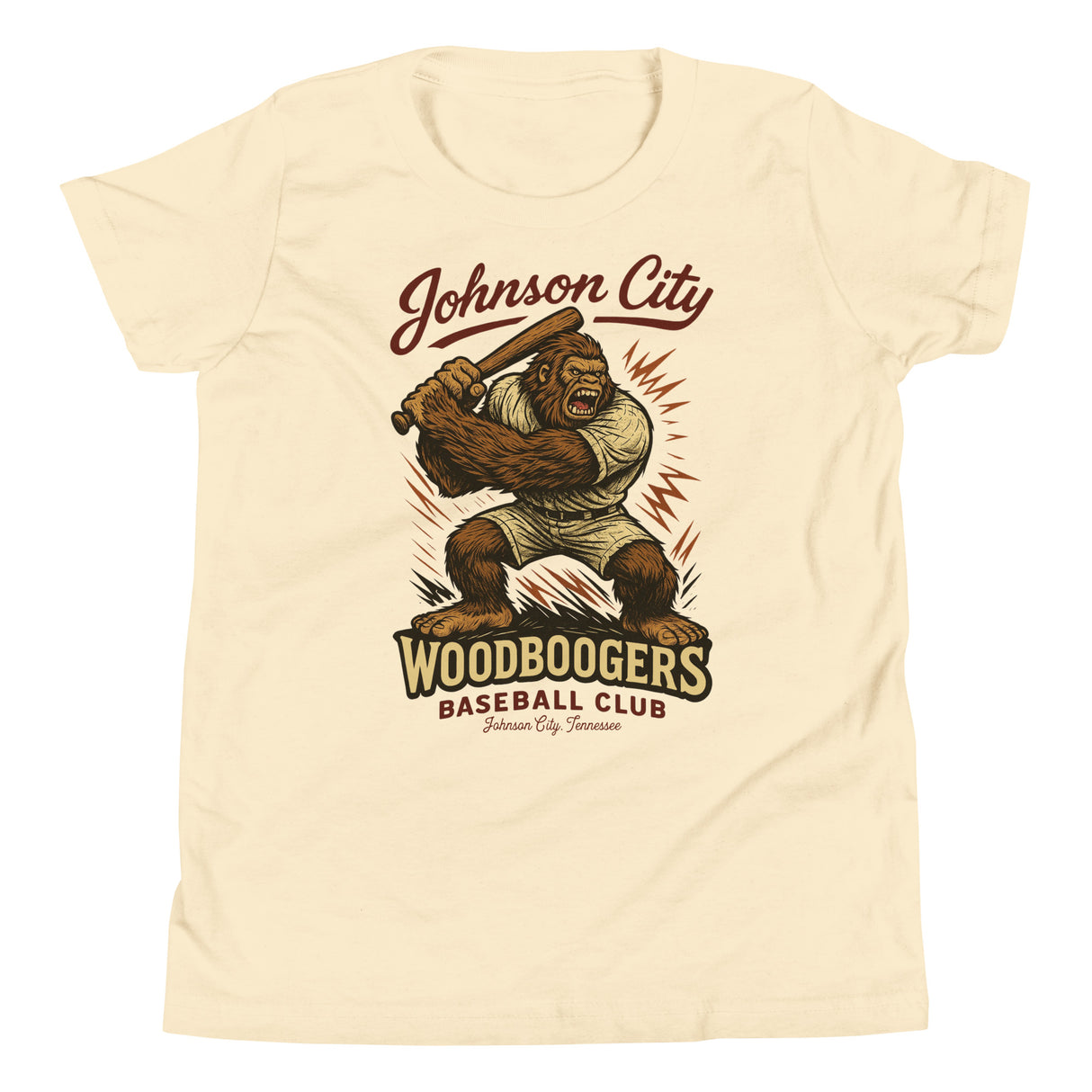 Flat lay of Johnson City Woodboogers youth t-shirt in natural featuring Bigfoot baseball mascot graphic on Bella Canvas 3001Y