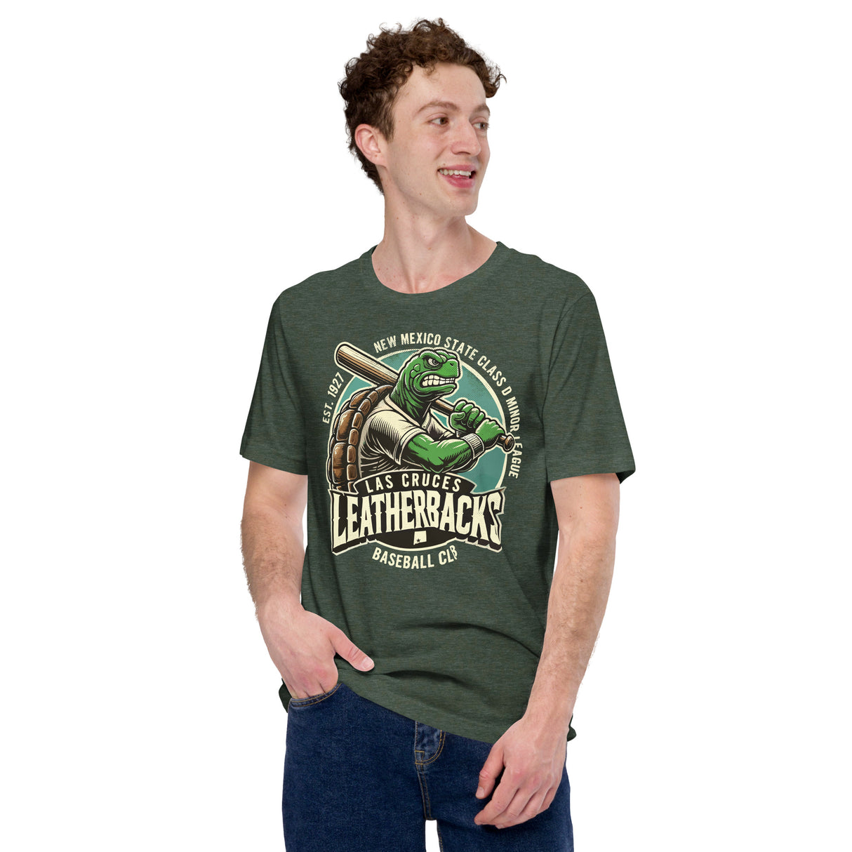 Male model wearing Las Cruces Leatherbacks baseball tee in heather forest green, showcasing the vintage minor league design and mascot