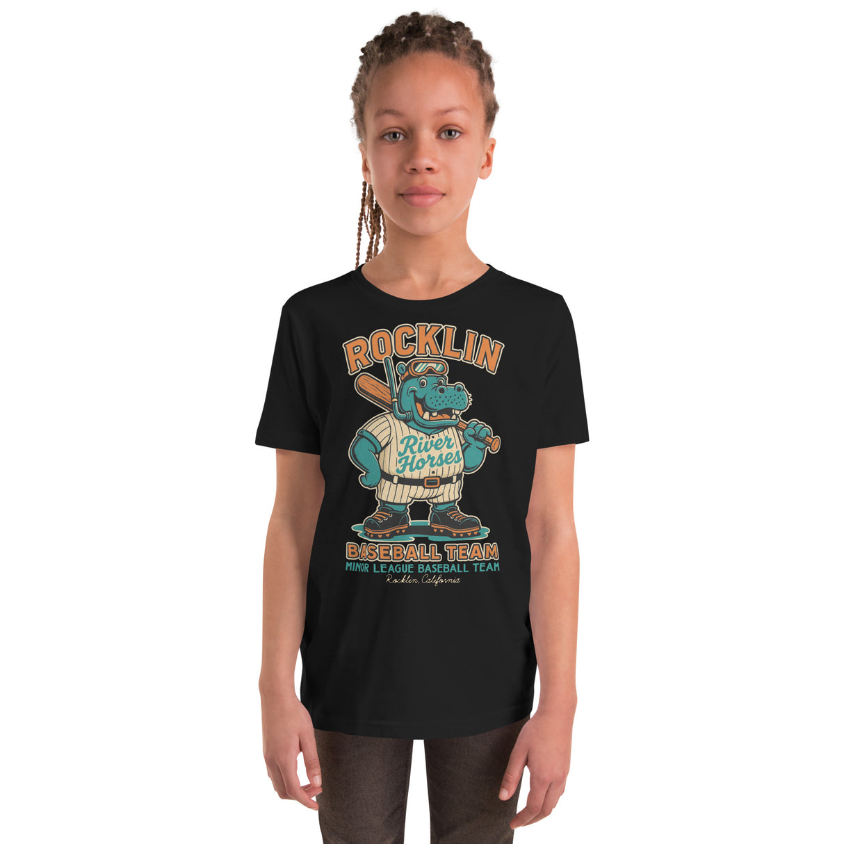 Youth girl model wearing Rocklin River Horses youth t-shirt in navy with cartoon hippo baseball mascot graphic