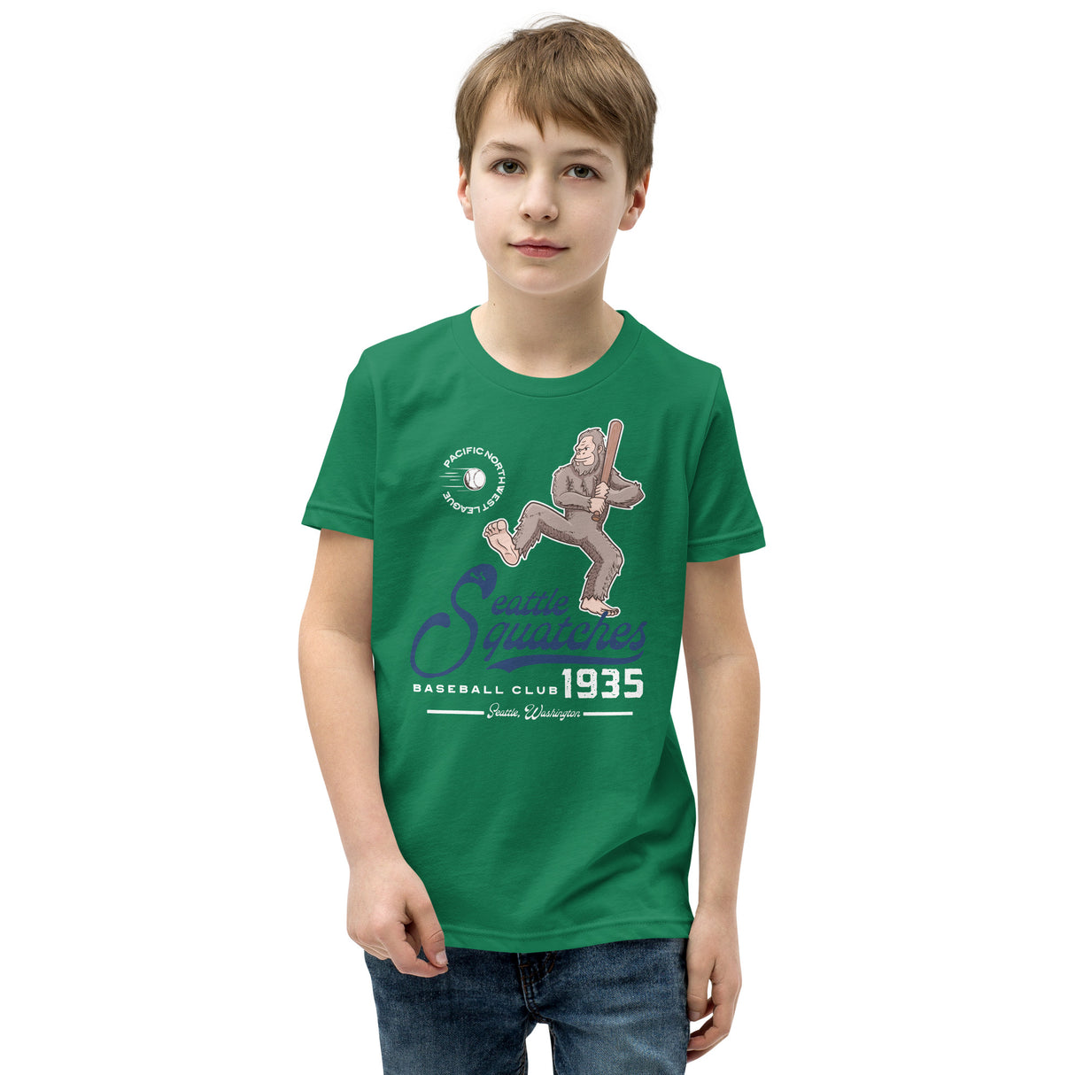 Youth boy model wearing Seattle Squatches mascot t-shirt in kelly green with Boone Dinger Bigfoot baseball design