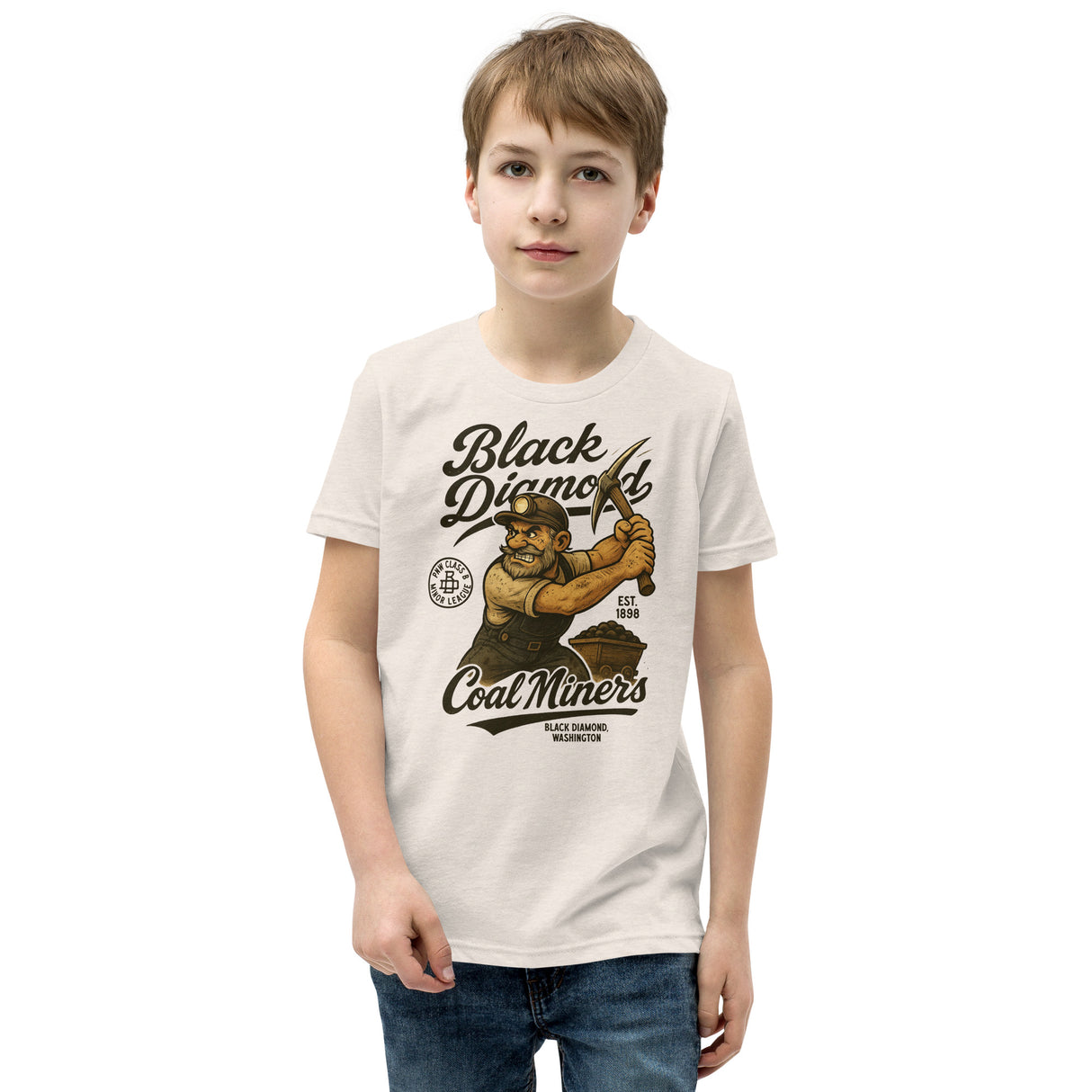Young boy wearing Outfield Outlaws Black Diamond Coal Miners youth tee in heather dust, front view with vintage miner mascot
