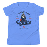 Flat lay of Castle Rock Counts youth t-shirt in Heather Columbia Blue, featuring a vintage vampire baseball mascot from a retro minor league team.