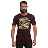 Man wearing Devil’s Den Nightstalkers t-shirt in oxblood black, showcasing the goblin baseball mascot in bold vintage style.