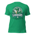 Flat lay of Fremont Lake Lurkers t-shirt in heather kelly green featuring a retro Nessie-inspired baseball mascot design.