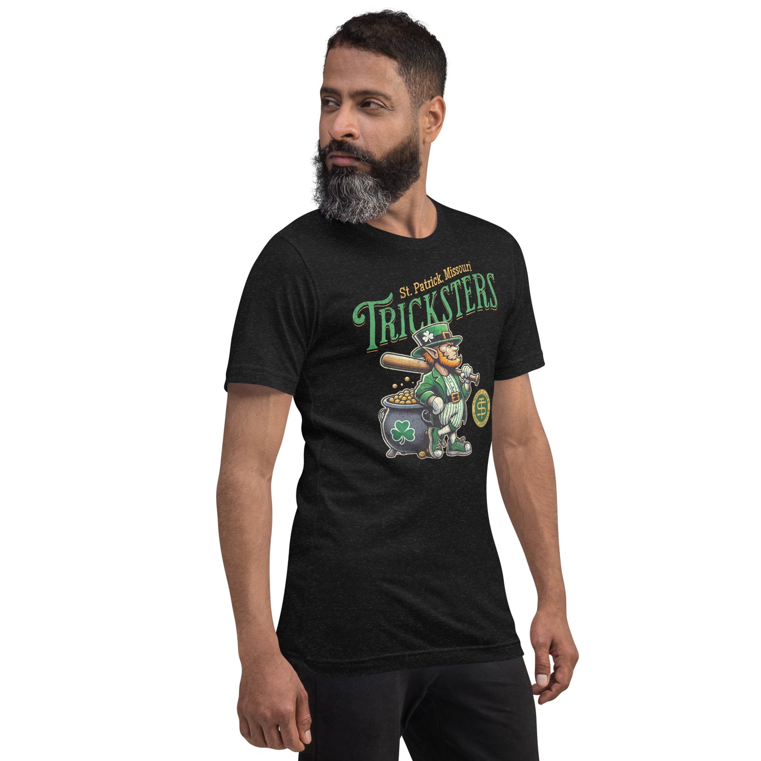Adult male model showing front and back of St. Patrick Tricksters Bella+Canvas tee in black, featuring retro leprechaun mascot