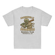 Flat lay of McMinnville Mummies youth retro baseball t-shirt in athletic heather, featuring vintage mummy mascot and old-school baseball design.