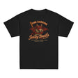 Flat lay of the Pine Barrens Jersey Devils youth t-shirt in black featuring a red cryptid devil mascot holding a bat, inspired by vintage minor league baseball.