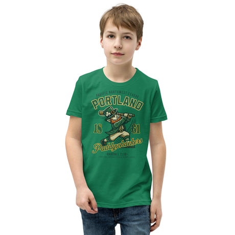 Young boy wearing Portland Paddywhackers youth t-shirt in kelly heather green, featuring vintage leprechaun baseball mascot graphic on the front.
