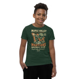 Youth boy model wearing Maple Valley Martians t-shirt in heather green with retro alien baseball mascot, Bella Canvas youth fit