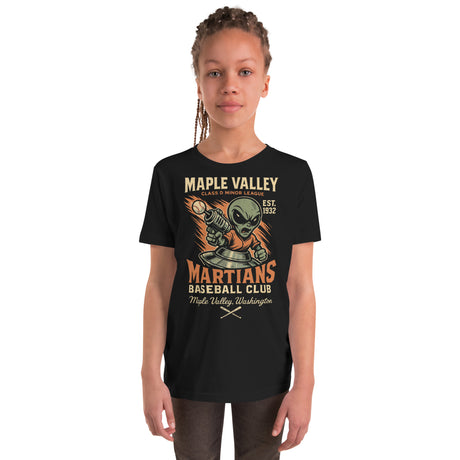 Youth girl model wearing Maple Valley Martians t-shirt in black with alien mascot baseball graphic from Outfield Outlaws