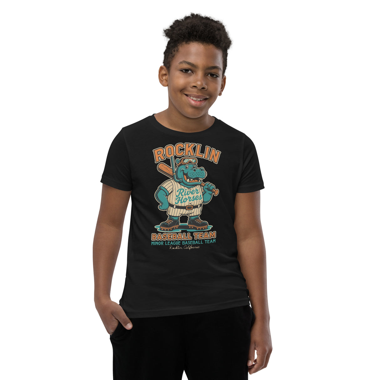 Youth boy model wearing Rocklin River Horses mascot shirt in black featuring baseball hippo design, Bella Canvas youth fit