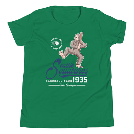 Flat lay of Seattle Squatches youth t-shirt in kelly green featuring Boone Dinger Bigfoot mascot on Bella Canvas 3001Y tee
