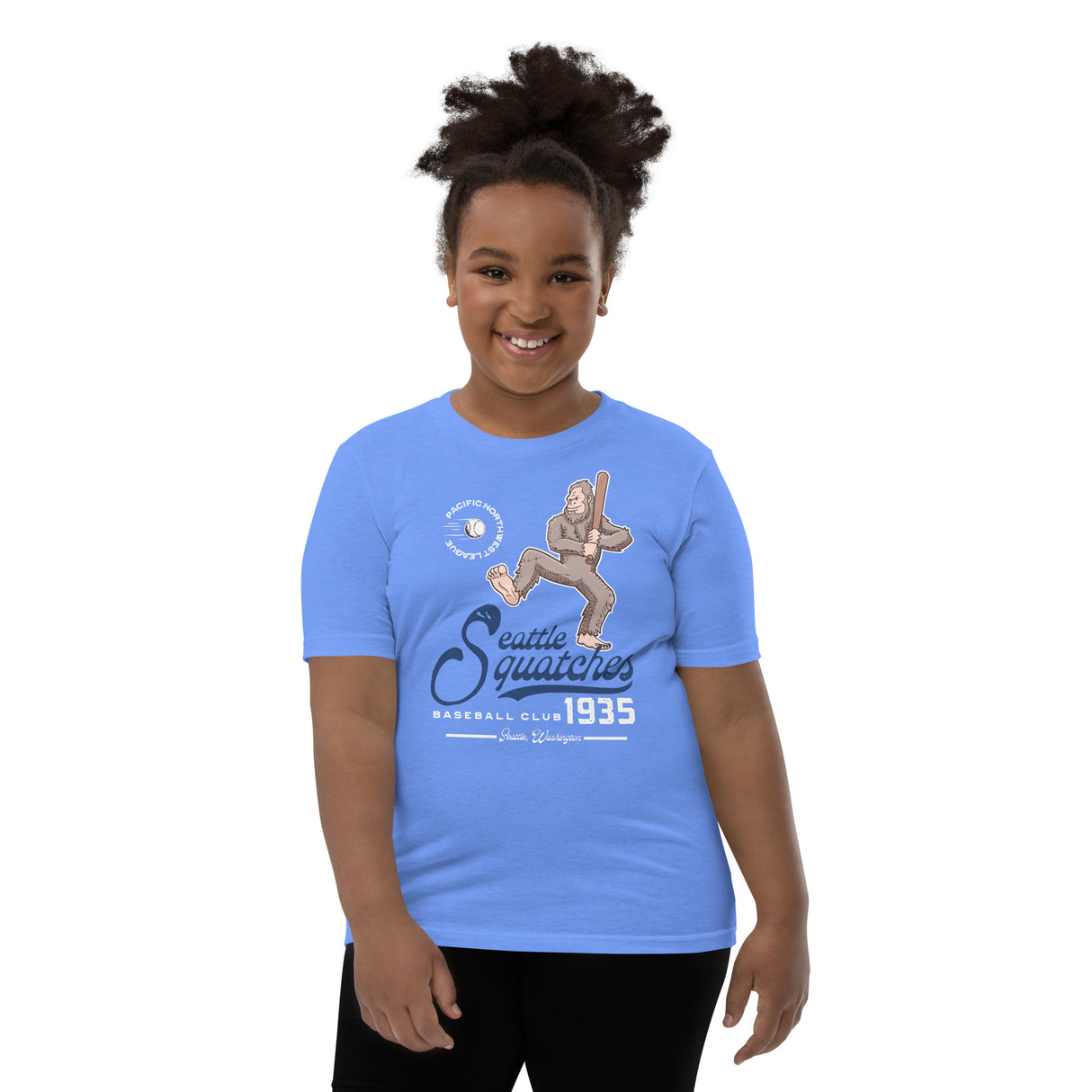 Youth girl model wearing Seattle Squatches Bigfoot mascot tee in Columbia blue, retro baseball shirt by Outfield Outlaws